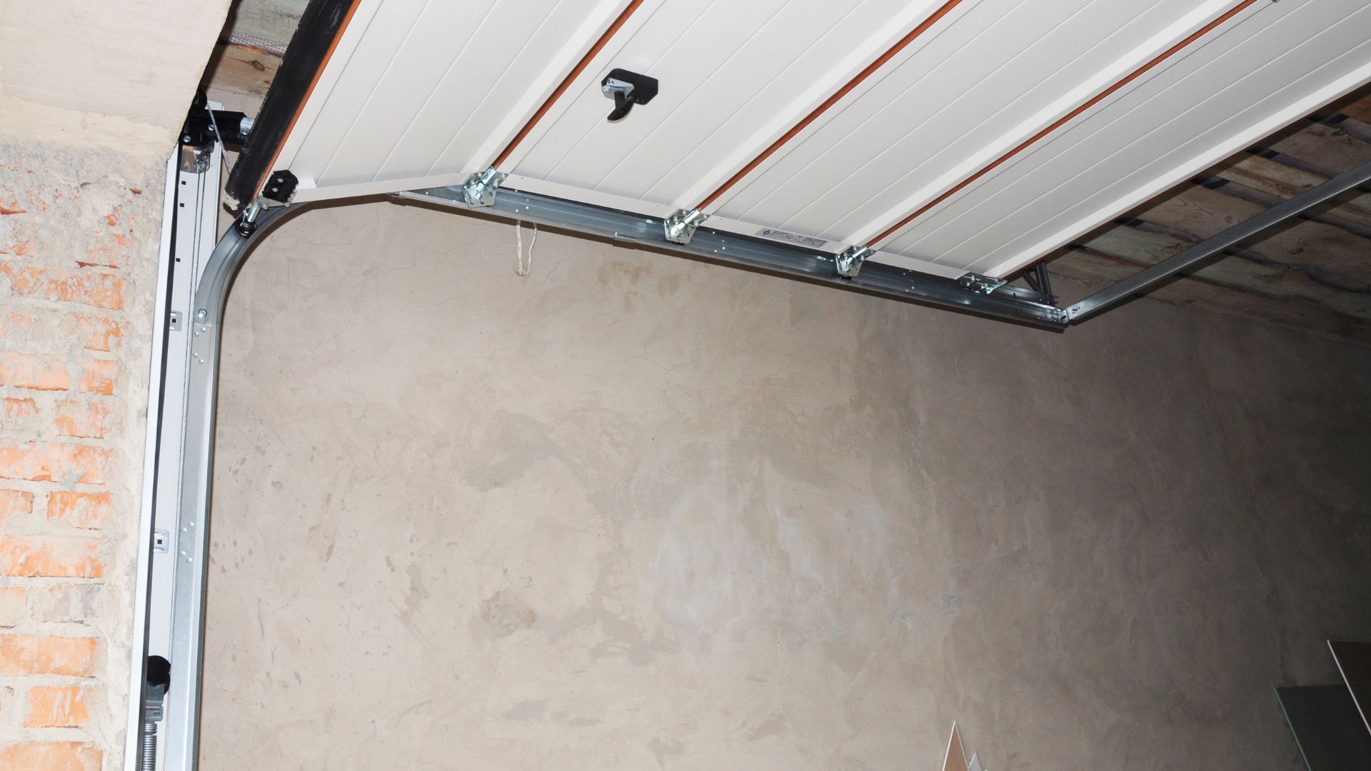 A close up of a garage door with the door open.