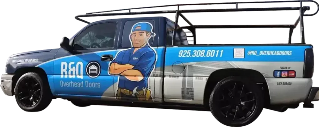A blue and white truck with a man on the side.