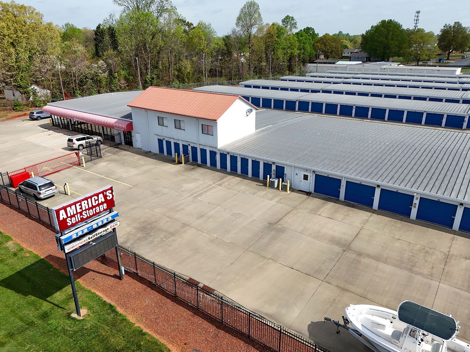 An aerial view of a self-storage facility with blue doors that provides climate controlled storage in Burlington, NC