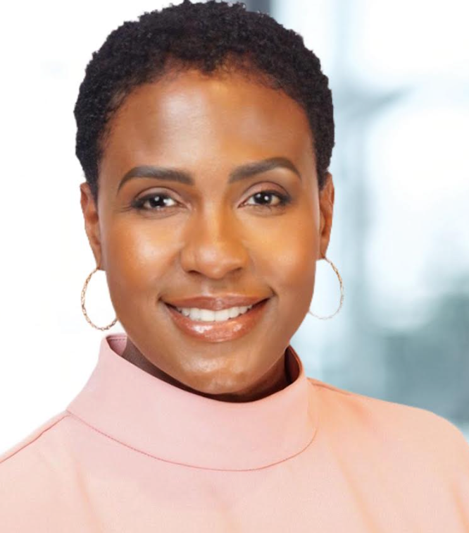 Smiling Black woman with short hair, wearing hoop earrings, and a pink top.