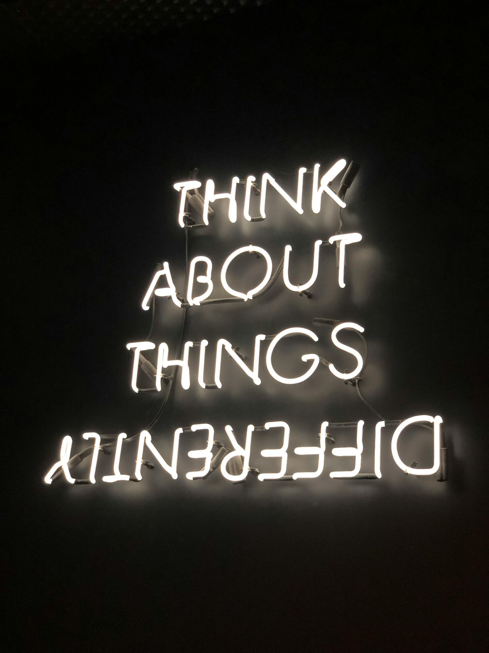 Neon sign on black background: