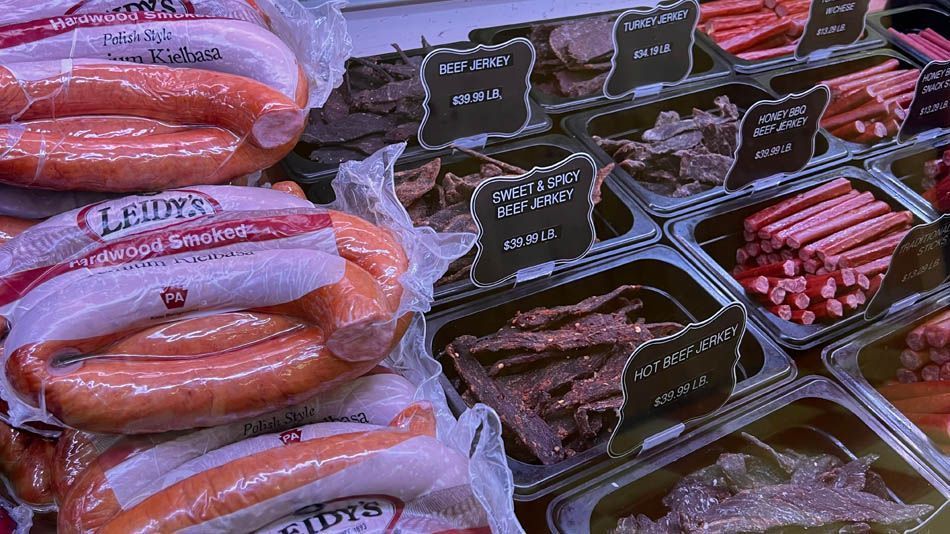 Meat display case: sausage and various beef jerky products.