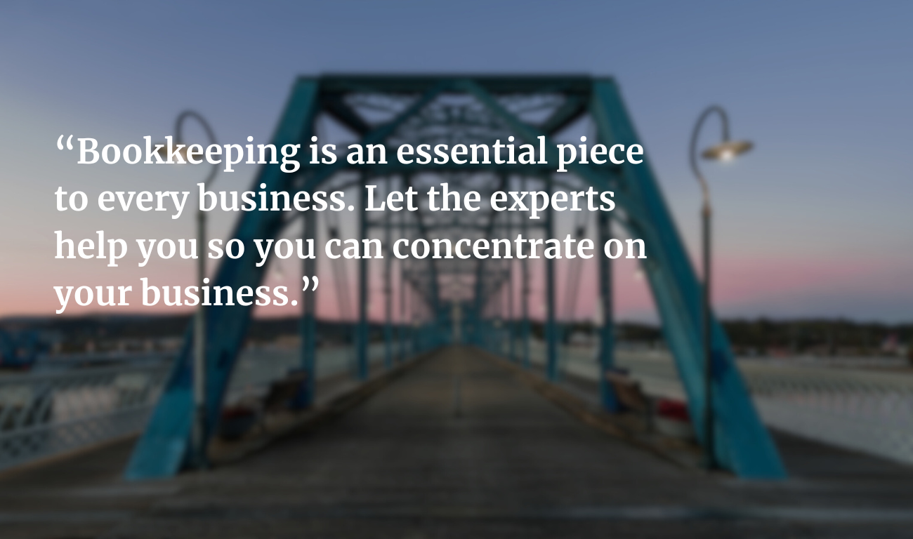 A blurry blue bridge at dusk with overlaid text about the importance of professional bookkeeping for businesses.