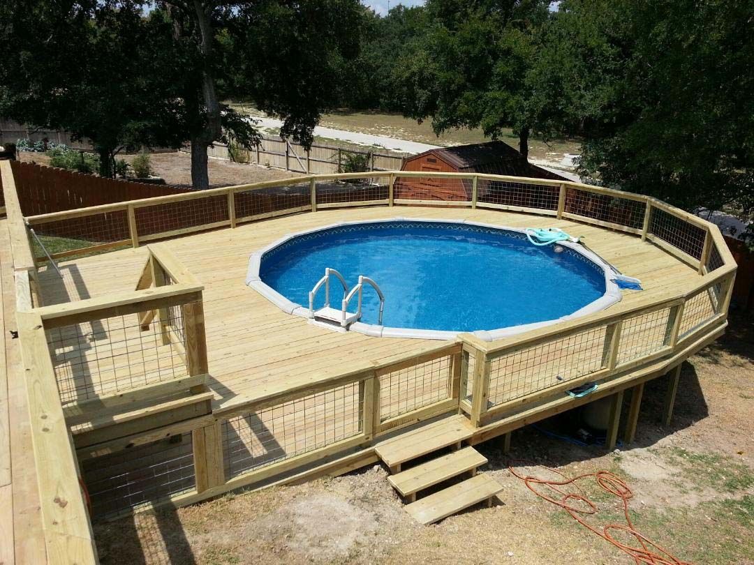 Large wooden pool deck with railing