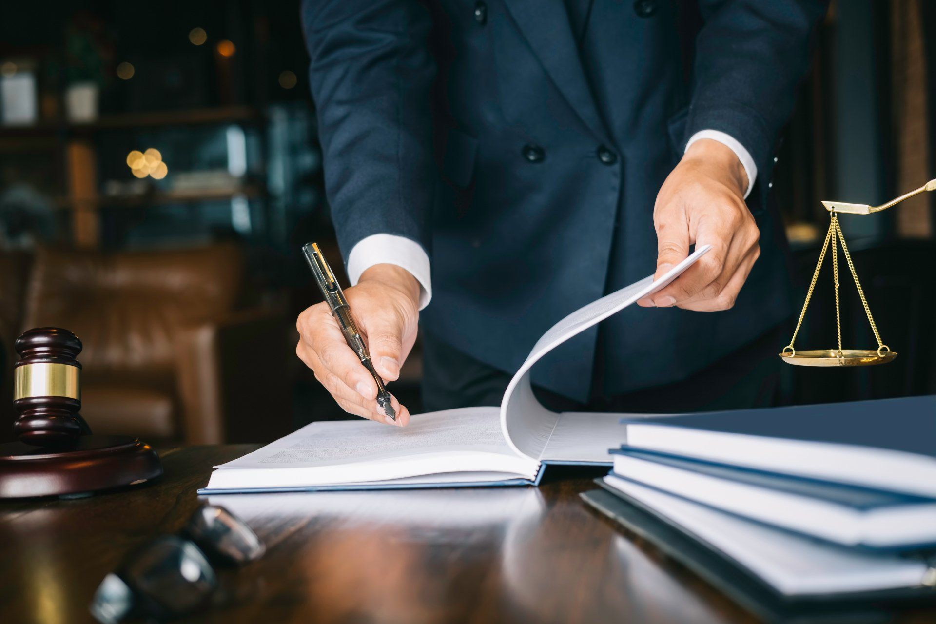 Attorney holding a pen and a notebook