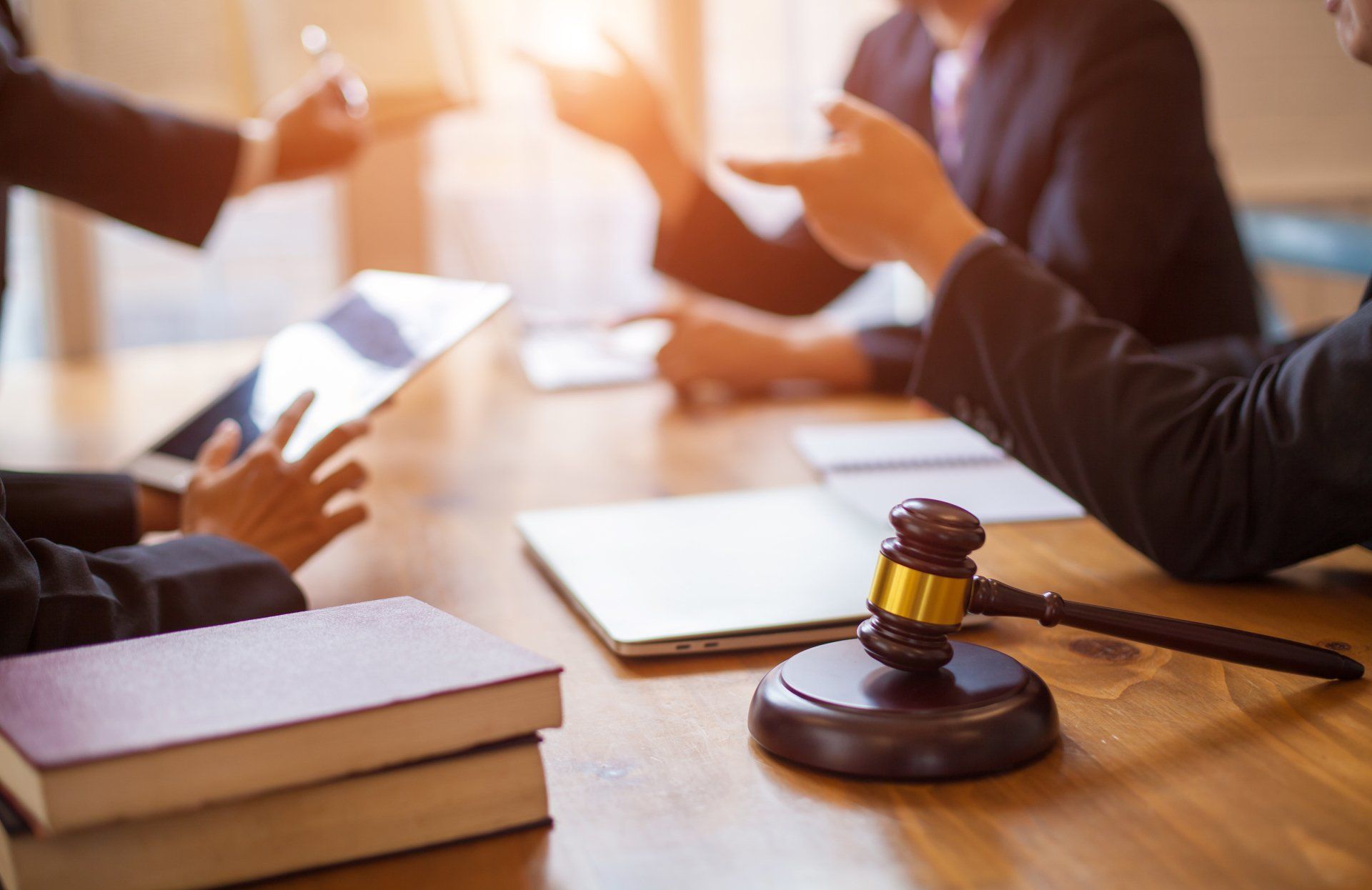 Group of business people and lawyers discussing contract papers