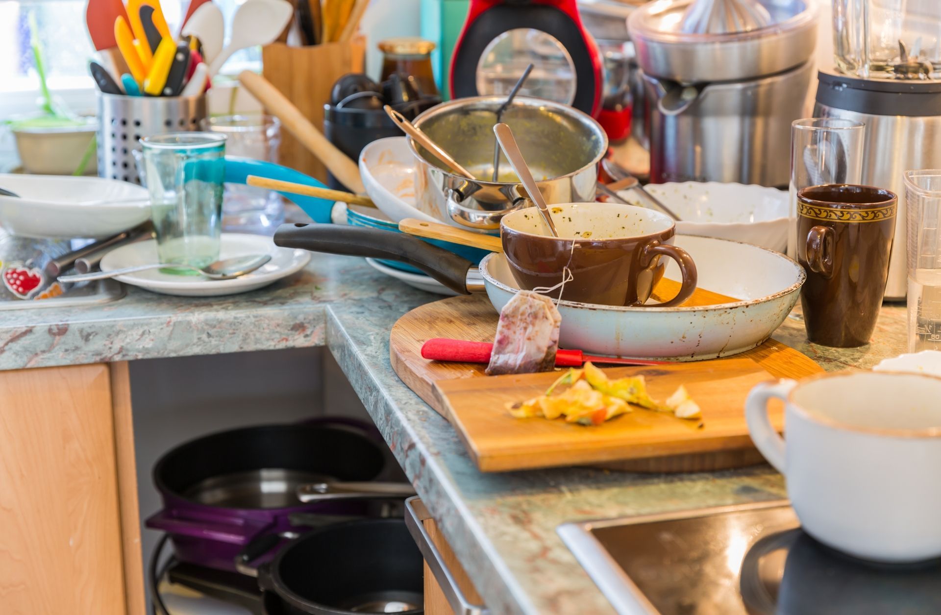 Cluttered kitchen before a hoarding cleanup service by Your Helpful Neighbors in Oakland County, Michigan.