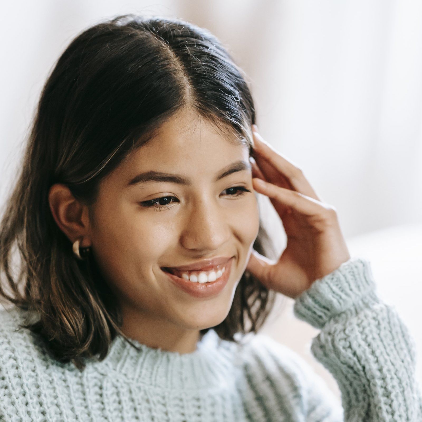 Smiling woman representing the caring and compassionate approach of Your Helpful Neighbors in Ferndale, Michigan.