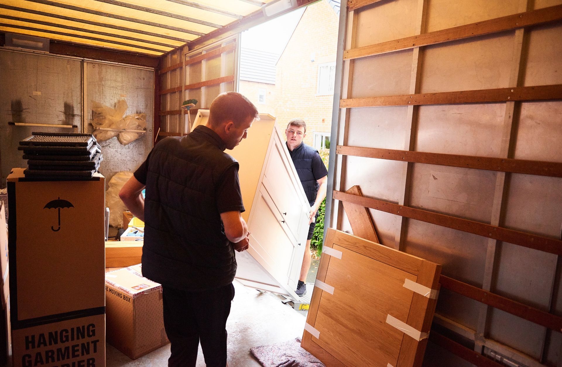 Team performing a garage cleanout and junk removal service in Ferndale, Michigan — Your Helpful Neighbors at work.