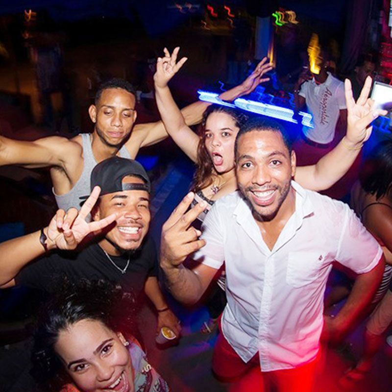 A group of people are posing for a picture at a party