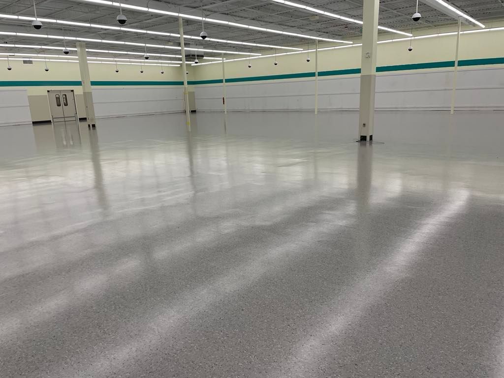 A large empty store with a shiny floor