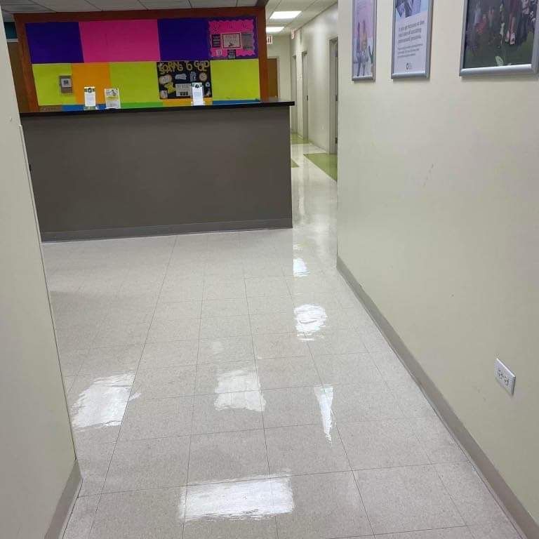 A hallway with a colorful wall and a counter