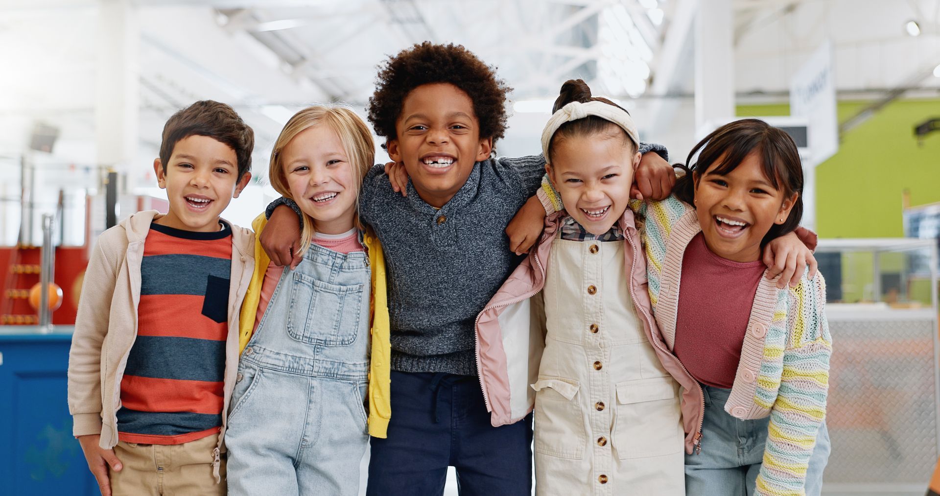A group of children are posing for a picture together.