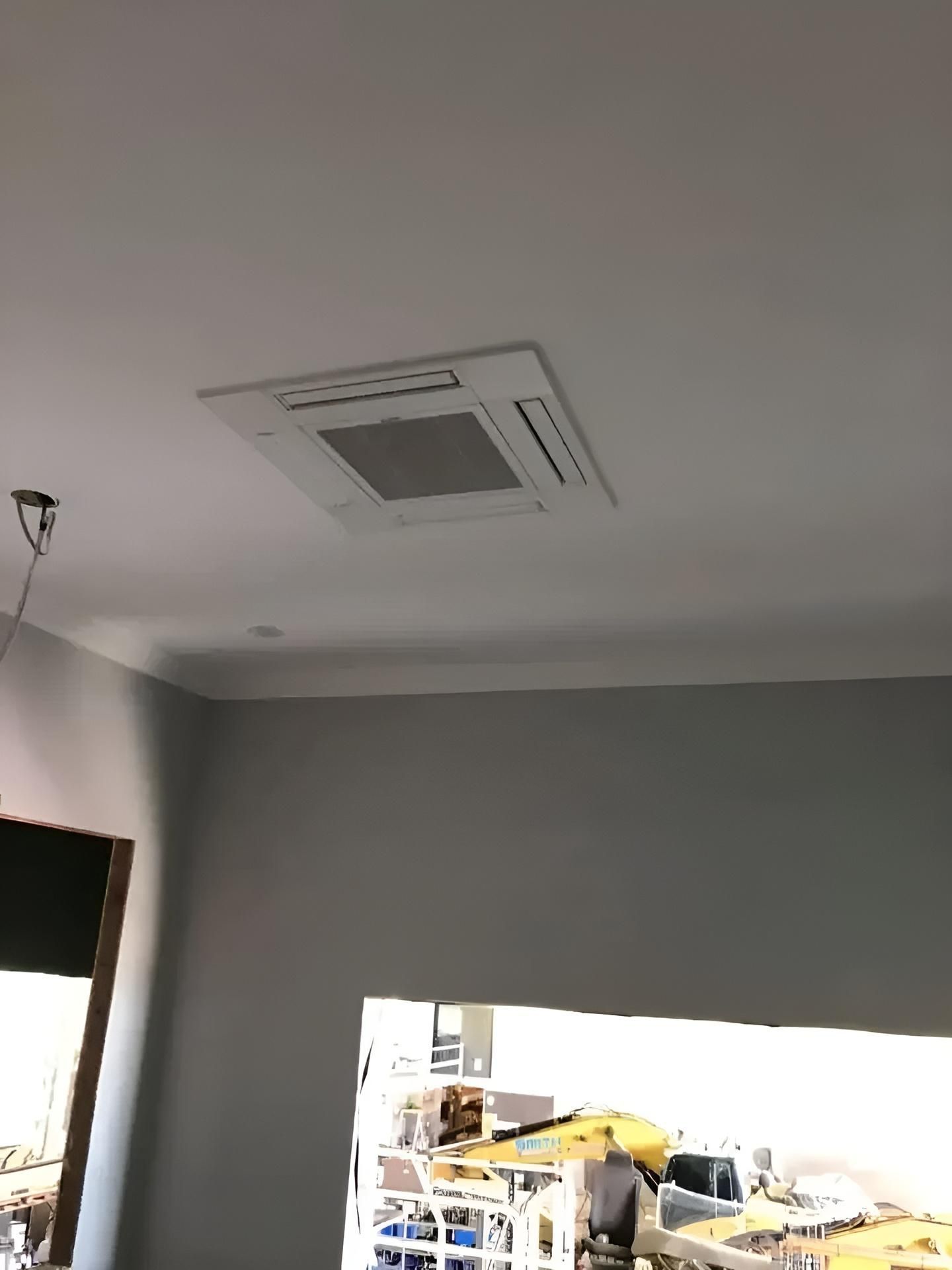 A Room With A Ceiling Fan Hanging From It — Beards Refrigeration & Air Conditioning in Bucasia, QLD