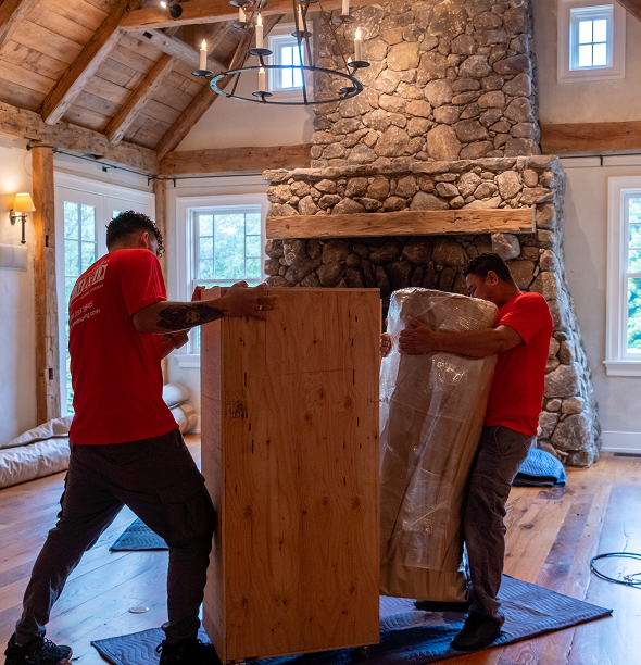 Smooth Move & Delivery team providing labor-only moving and furniture lifting services in a Norwalk, CT home.