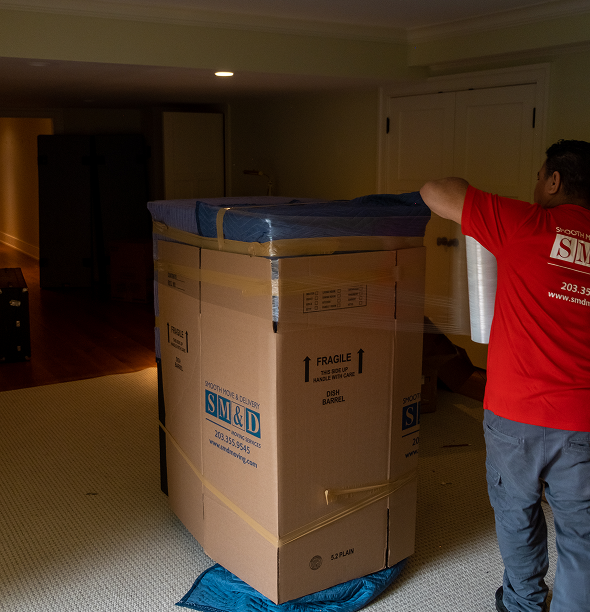 Smooth Move & Delivery team providing labor-only moving and furniture lifting services in a Norwalk, CT home.