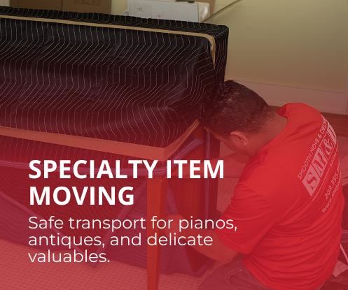 Expert handling of delicate and high-value belongings. Man in red shirt securing a wrapped piano during a move. Text: Specialty Item Moving.
