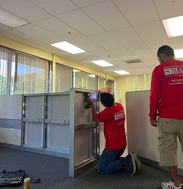 Smooth Move & Delivery team performing a professional office move in Stamford, handling office furniture and cubicle relocation.