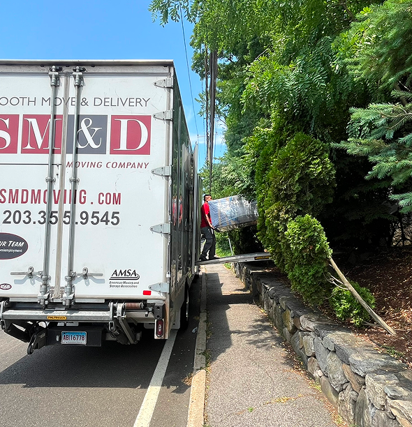Large Smooth Move & Delivery truck parked for a residential long-distance move in Norwalk, CT.