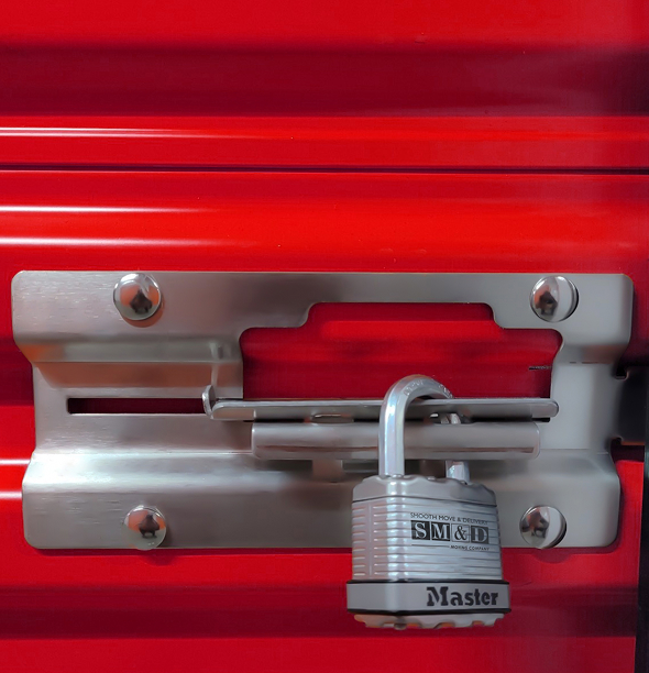Red storage unit door with silver lock and latch.