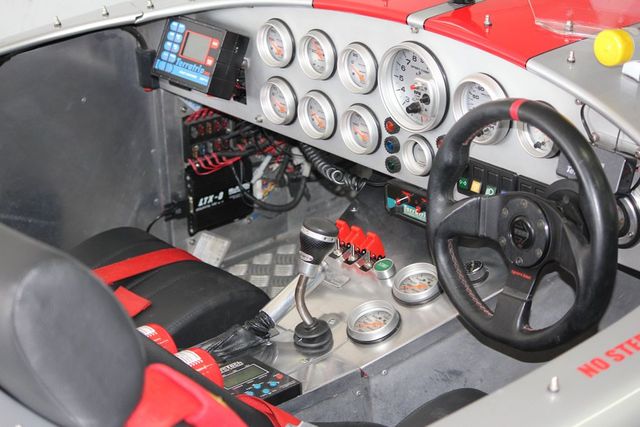 Interior of race car with all dials for racing.