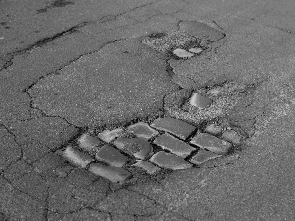 driveway in need of tarmac resurfacing