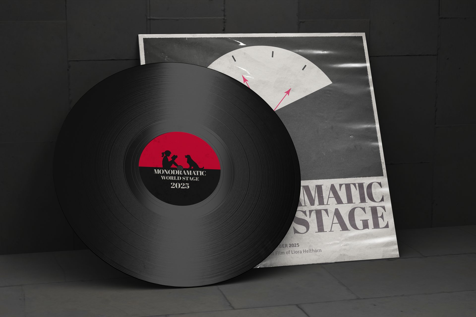 Black vinyl record in front of a grayscale album cover with red logo and white folded paper art