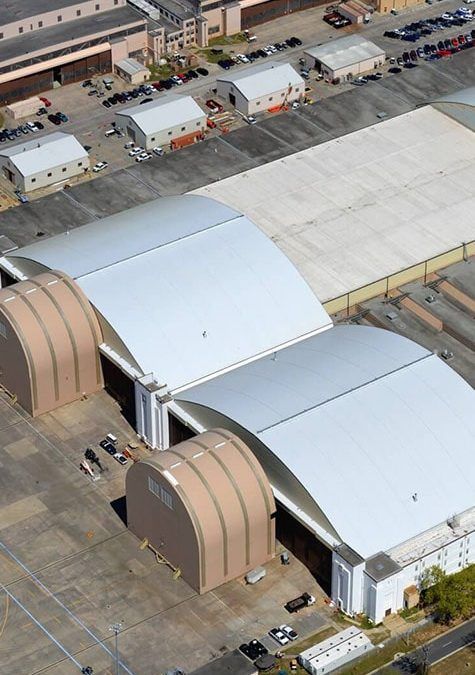 An aerial view of a large building with arched roofs