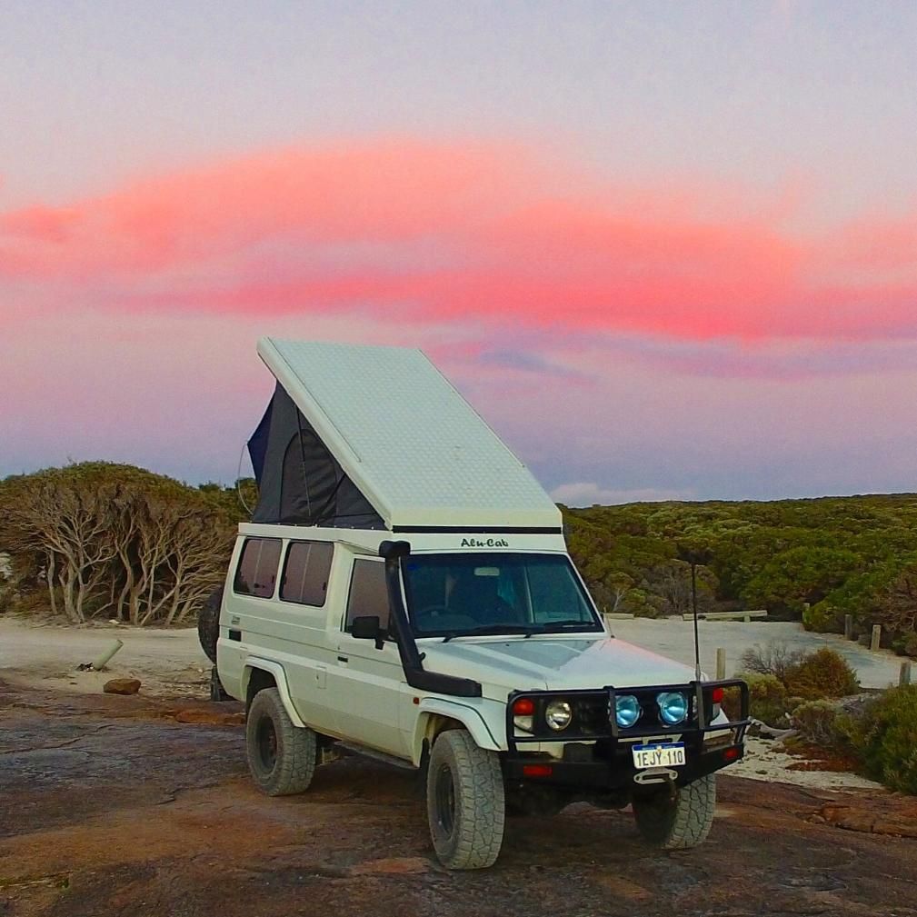 A White Truck With a Tent on Top of It — Whitsunday 4x4 & Automotive In Cannonvale, QLD