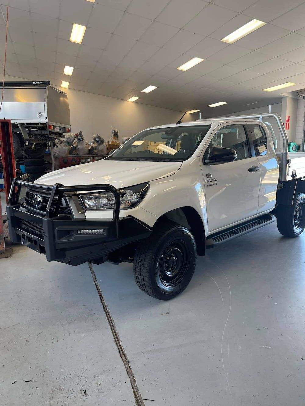 A White Truck is Parked in a Garage — Whitsunday 4x4 & Automotive In Cannonvale, QLD