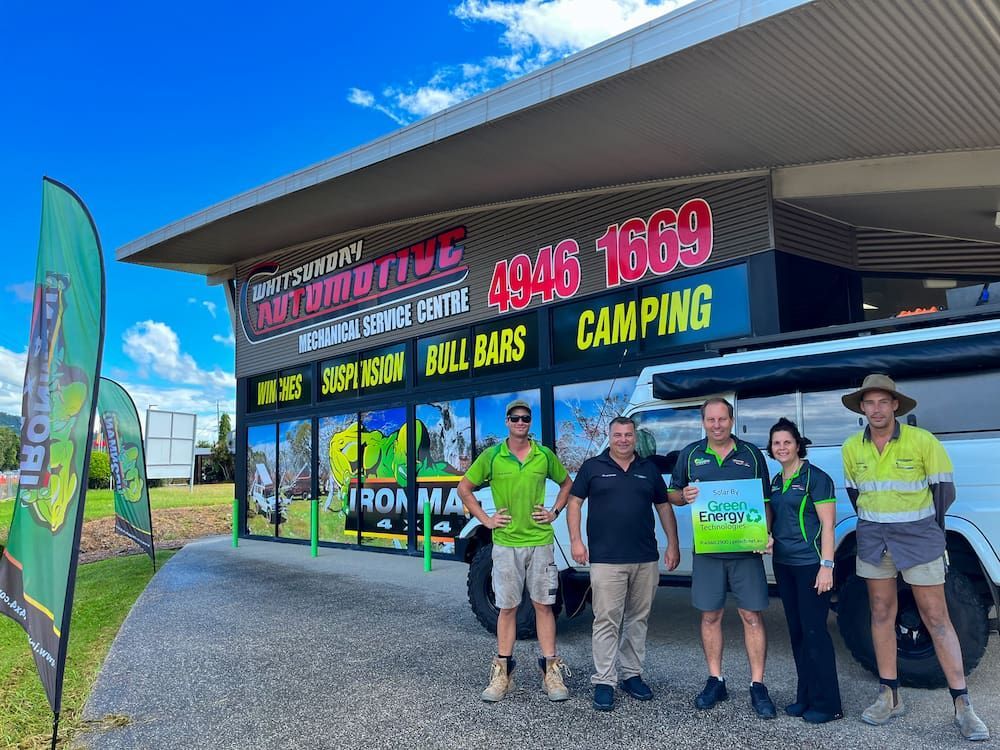 A Group of People Are Standing in Front of a Building — Whitsunday 4x4 & Automotive In Cannonvale, QLD