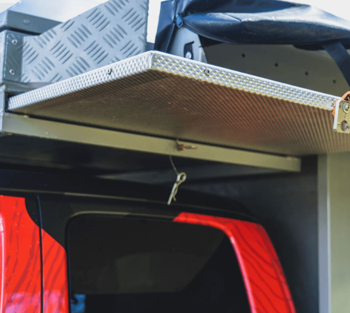 A Red Truck with a Roof Rack Attached to it - Whitsunday 4x4 & Automotive In Cannonvale, QLD