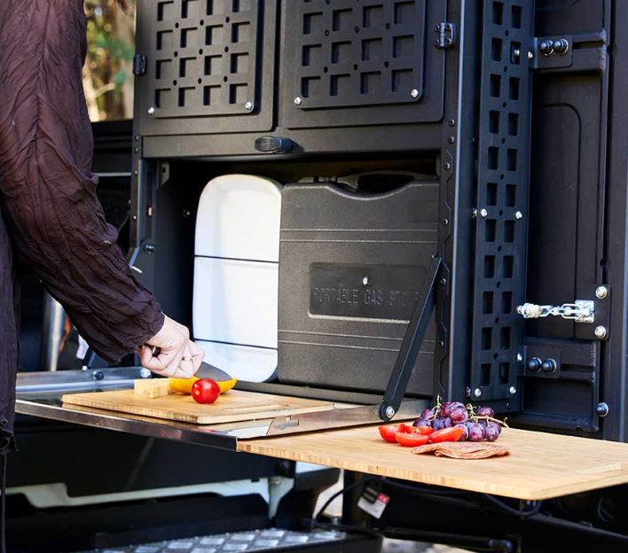 A Person is Cutting Vegetables on a Wooden Cutting Board - Whitsunday 4x4 & Automotive In Cannonvale, QLD
