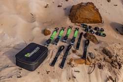 A bag of tools is sitting on top of a sandy beach next to a rock - Whitsunday 4x4 & Automotive In Cannonvale, QLD