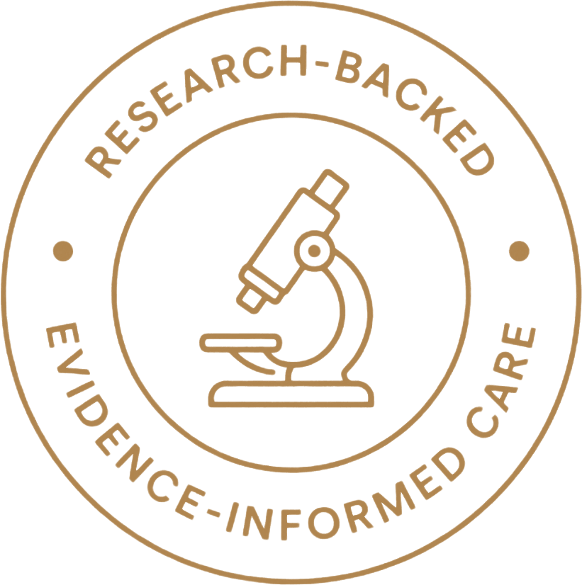 Gold seal with microscope icon and the words “Research-backed” and “Evidence-informed care.”