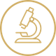Gold microscope icon inside a circle on a white background