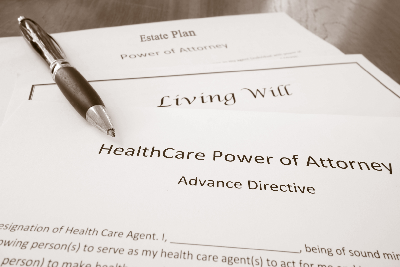 A pen rests on top of a healthcare power of attorney advance directive