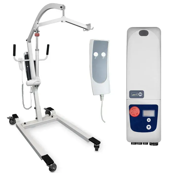 A white mobile patient lift, a handheld control remote, and a separate control box against a white background.