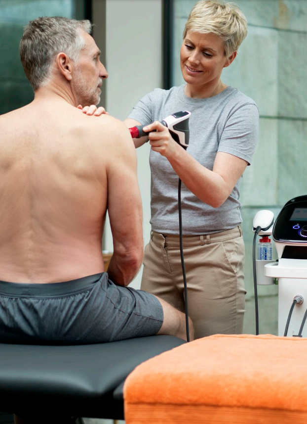 man getting shockwave therapy