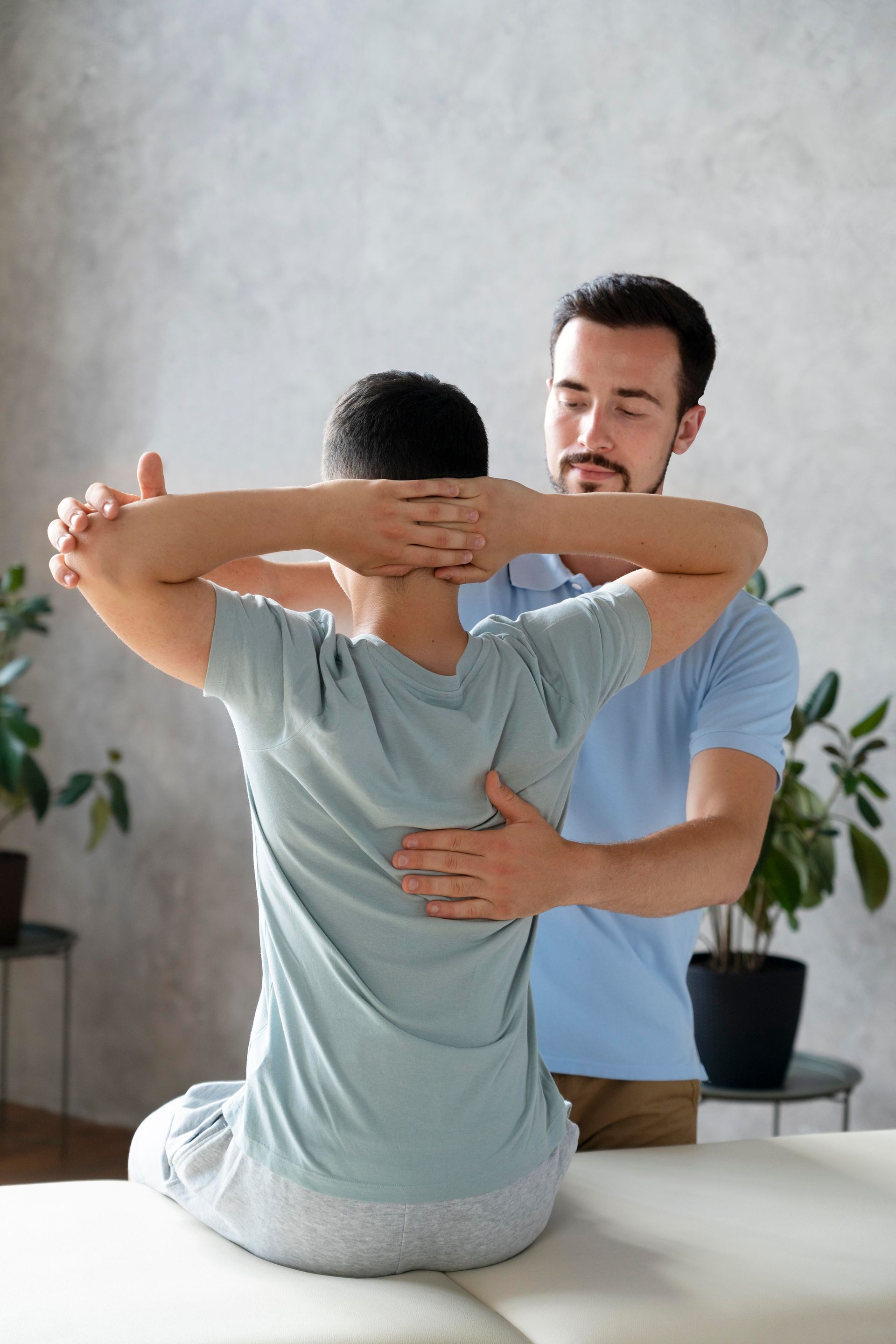 doctor checking patients back