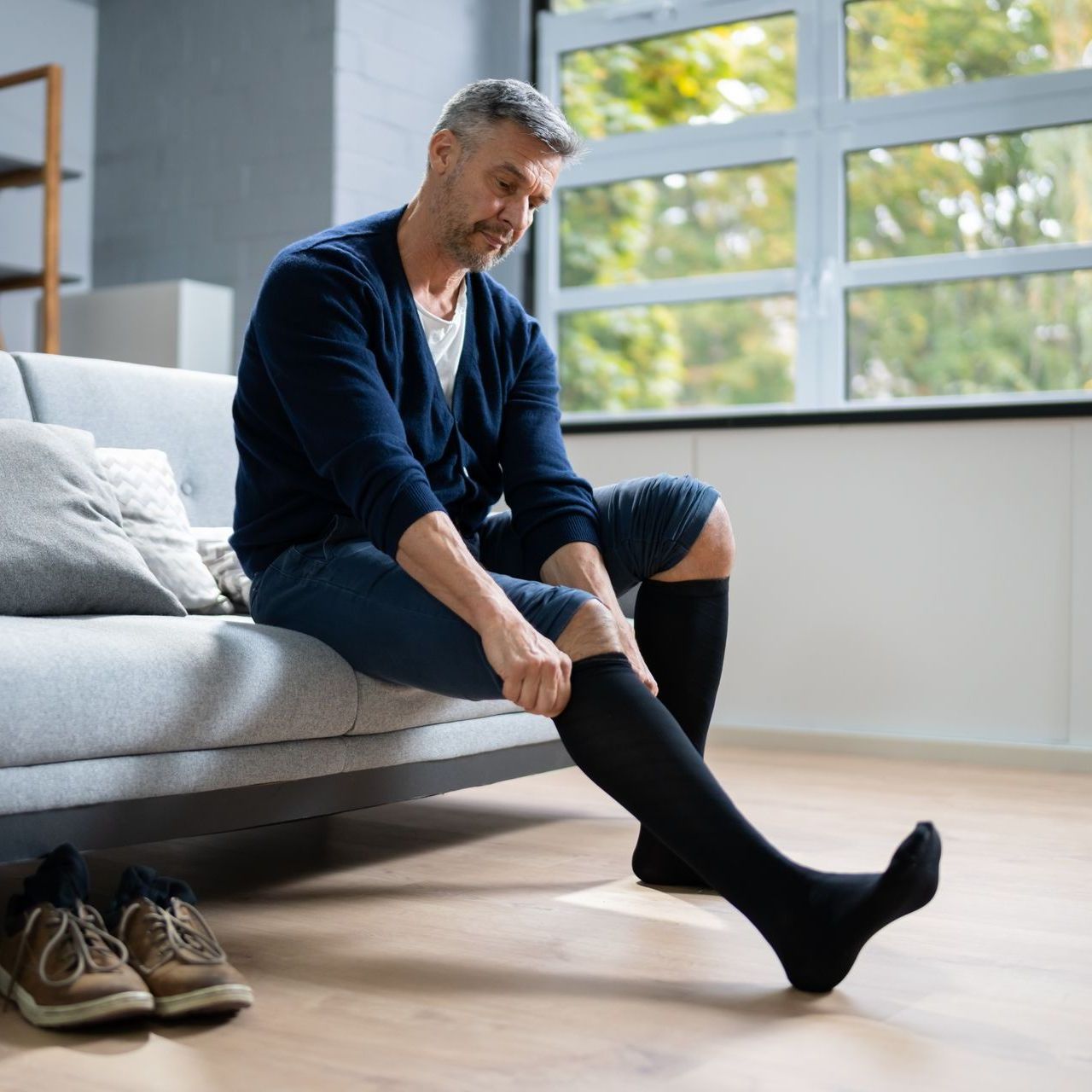 man putting on stockings