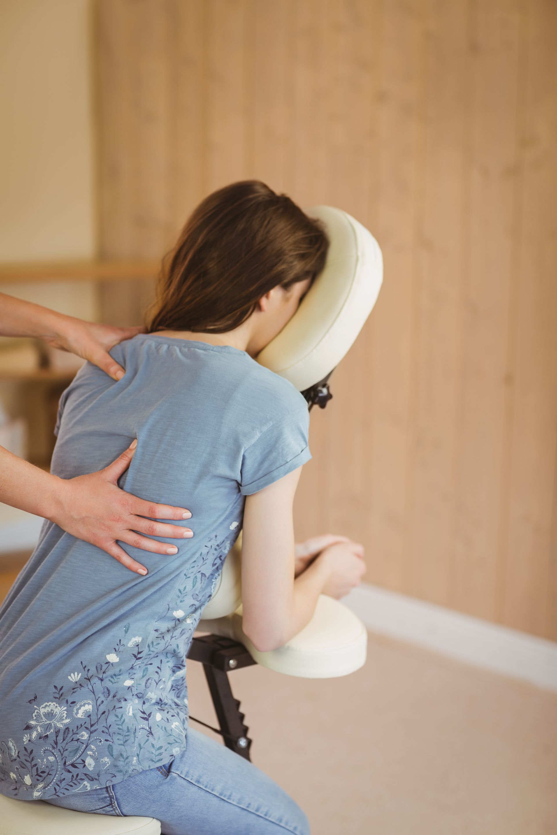 young woman in massage chair