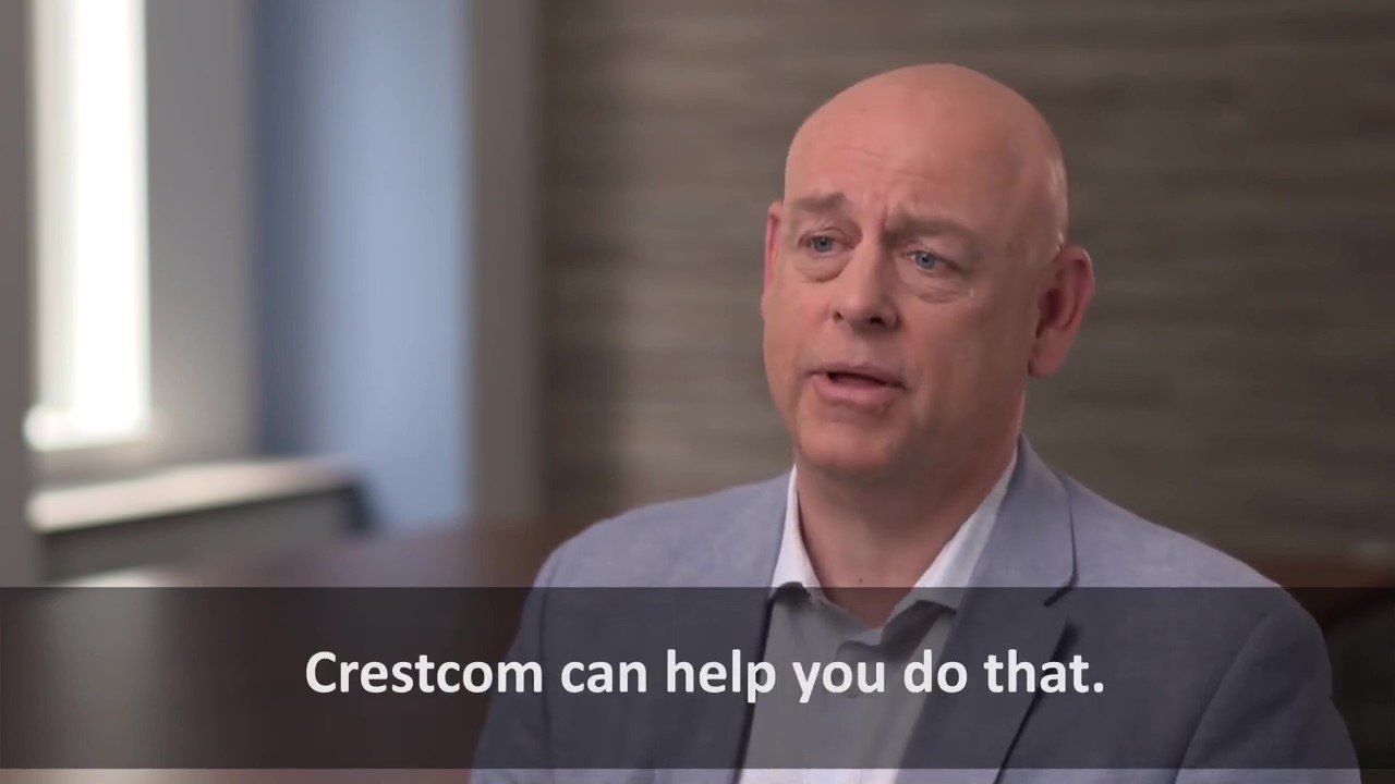 A man in a suit is talking to someone and says crestcom can help you do that.