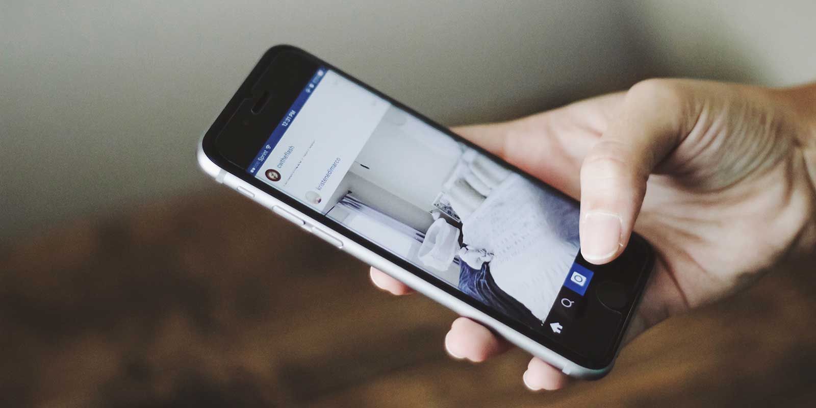 A person is holding a cell phone in their hand