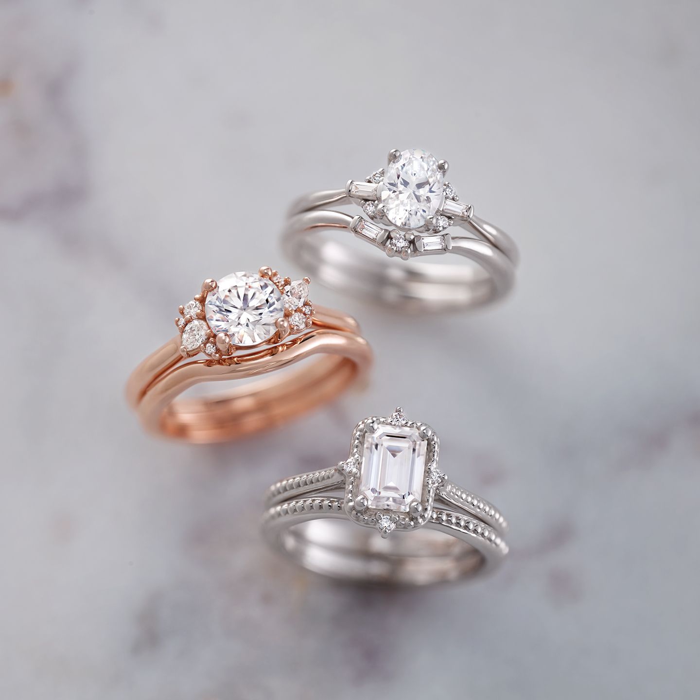 Three rings are sitting on top of each other on a table.