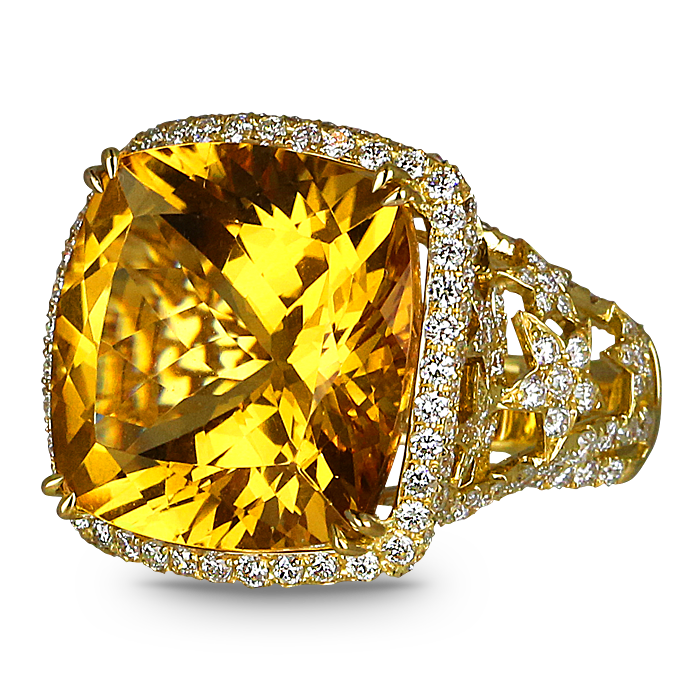 A gold ring with a yellow stone and diamonds