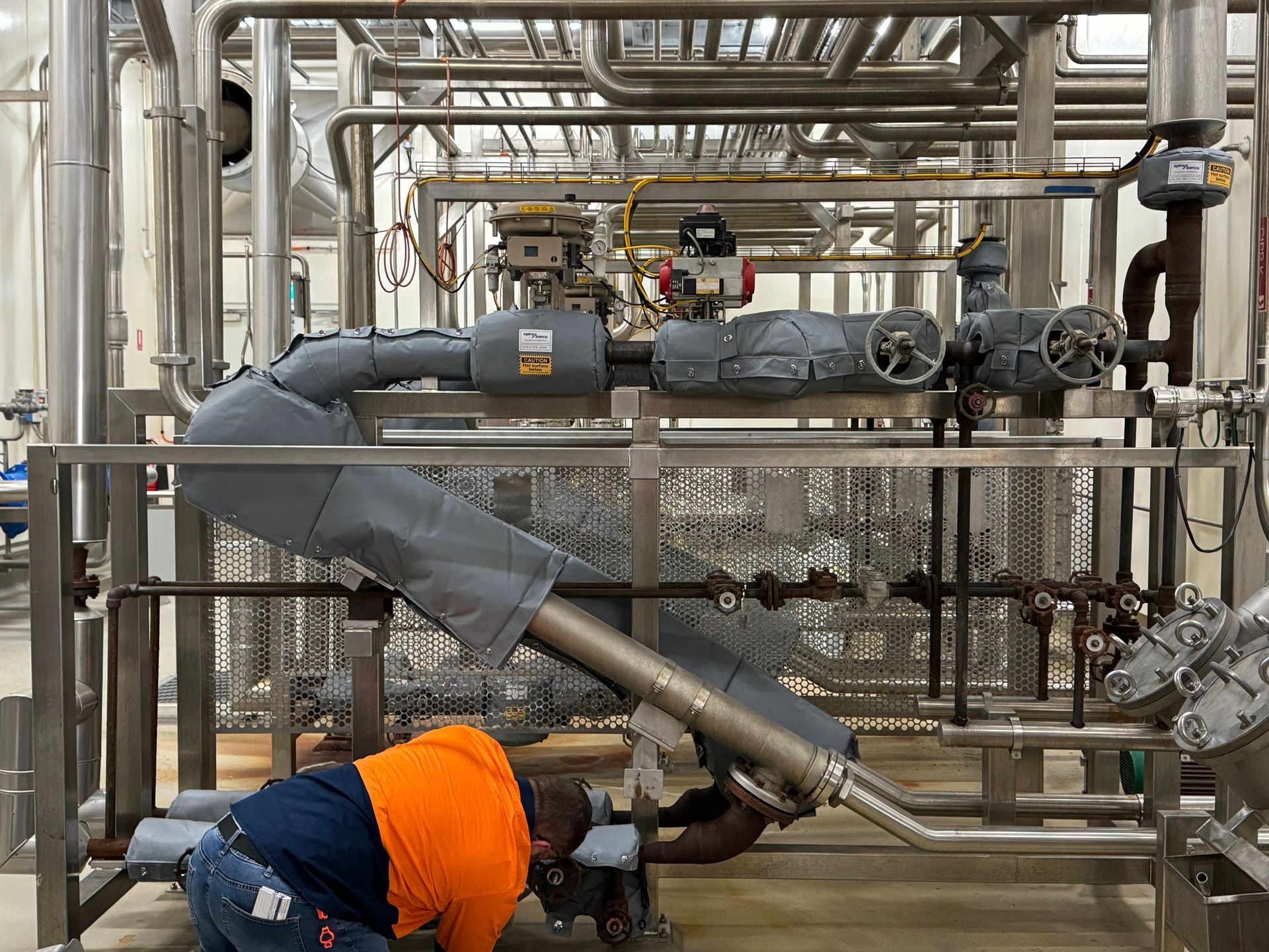  Insulock employee installing Thermocovers, Insulation Blankets, Insulation Jacketing over valves.
