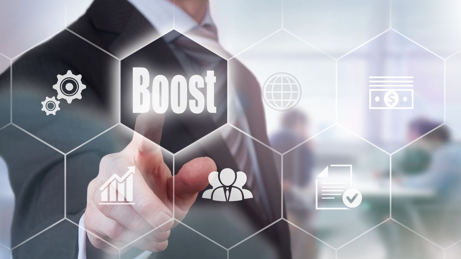 A man is pressing a button on a screen that says boost.