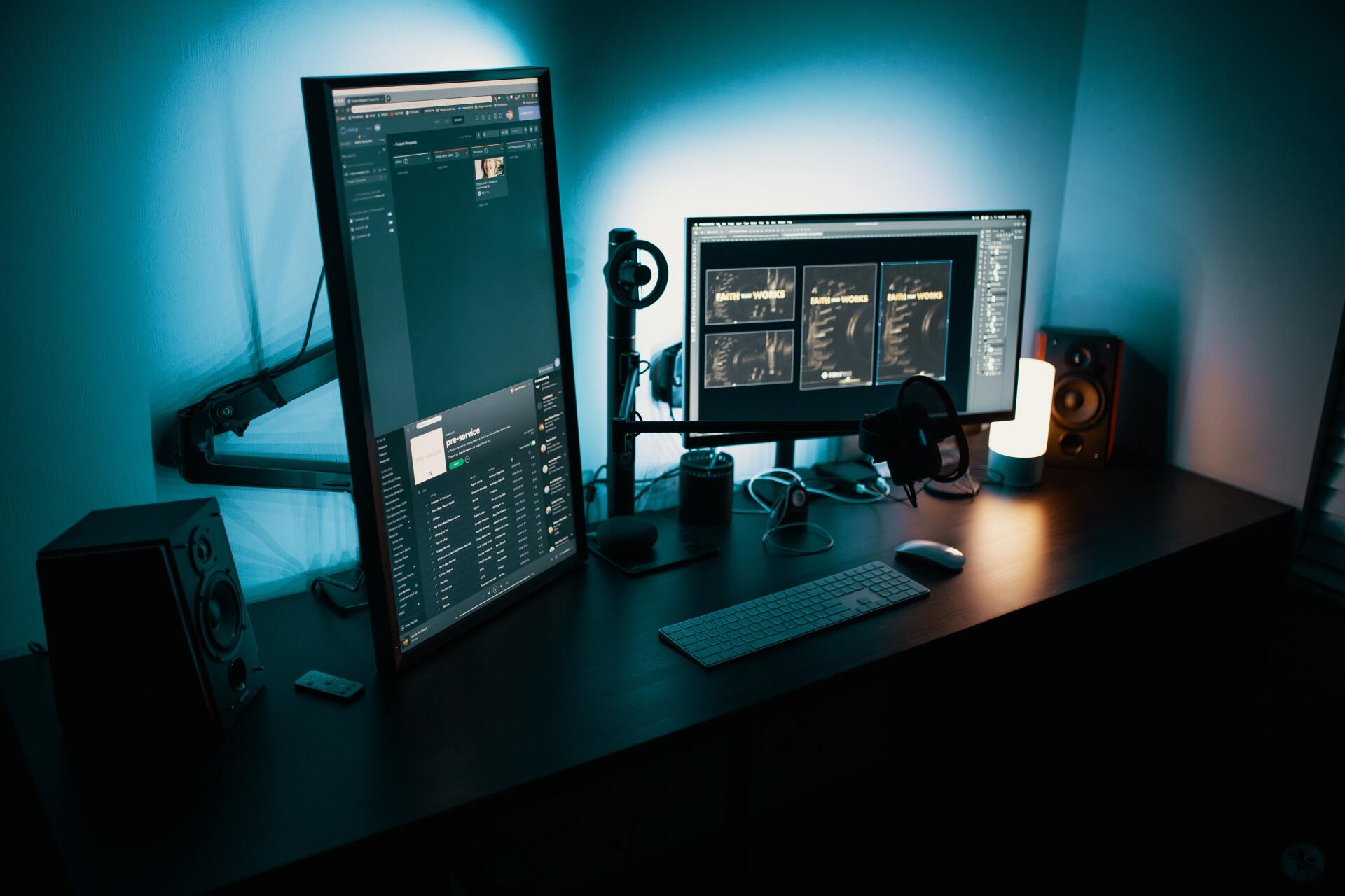 A computer desk with two monitors , a keyboard , and a mouse.