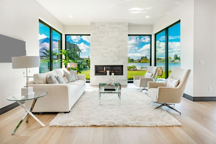 living area with granite fireplace